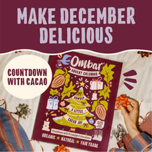 Promotional graphic for Ombar’s organic, fair-trade cacao advent calendar, surrounded by festive wrapped chocolates. Text reads “Make December delicious” and “Countdown with cacao,” with a warm, playful holiday feel.