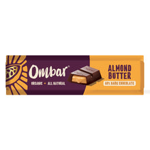An Ombar organic dark chocolate bar with almond butter filling, shown on a purple and orange wrapper. The packaging feels bold and appetizing.