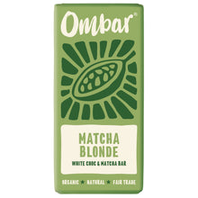Green Ombar Matcha Blonde white chocolate and matcha bar wrapper, with a stylized cacao pod and organic, natural, fair trade labels; fresh, earthy tone.