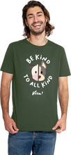 Man wearing a green t-shirt with a printed design and text.