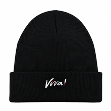 A black ribbed knit beanie hat with a folded cuff, featuring the word 'Viva!' embroidered in white script with a small red exclamation mark on the front, set against a plain white background.