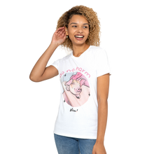 A woman wearing a white graphic t-shirt with a cartoon pig and the text 'do no harm' and 'Wim!', paired with blue jeans, against a plain white background