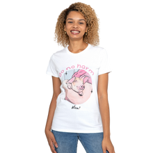 A woman wearing a white graphic t-shirt with a cartoon pig and the text 'do no harm' and 'Wim!', paired with blue jeans, against a plain white background