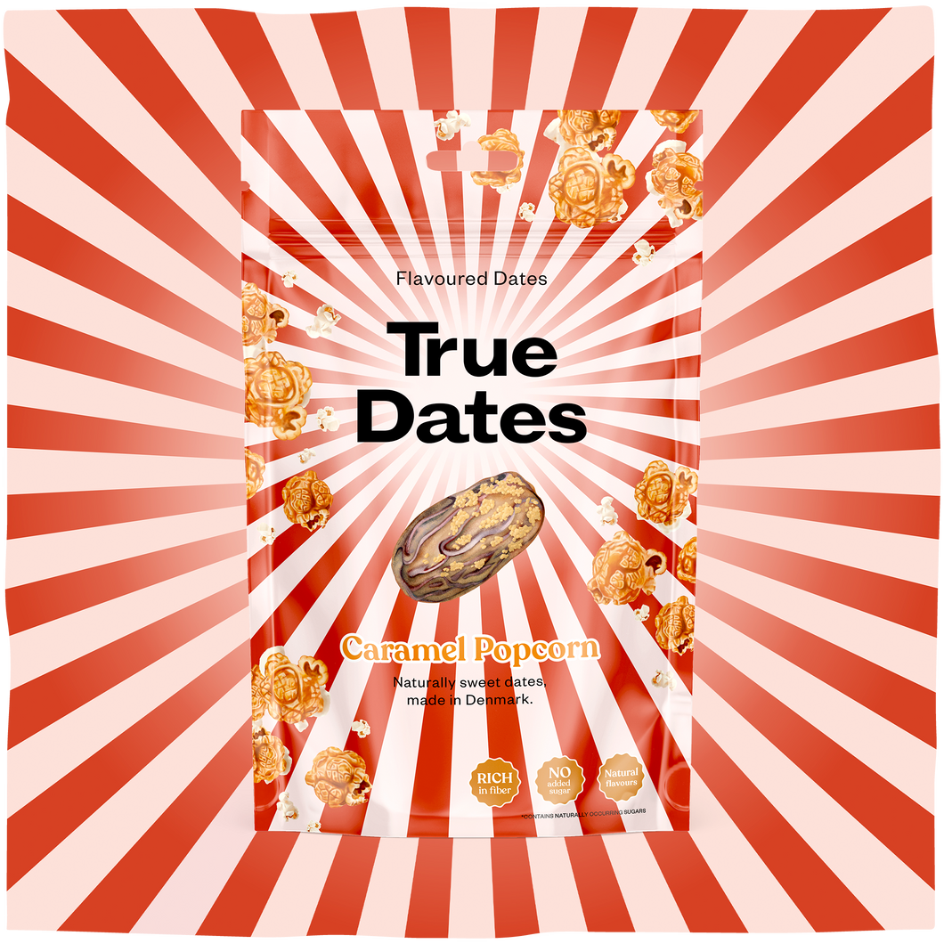 A red-and-white sunburst package for “True Dates” flavoured dates, with caramel popcorn labeling, golden date illustrations, and one date pictured.