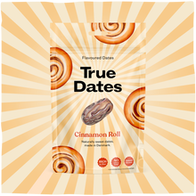 A packet of True Dates cinnamon-roll flavoured dates sits against a cream-and-orange sunburst, decorated with spiral pastries and one date. Warm, playful packaging.