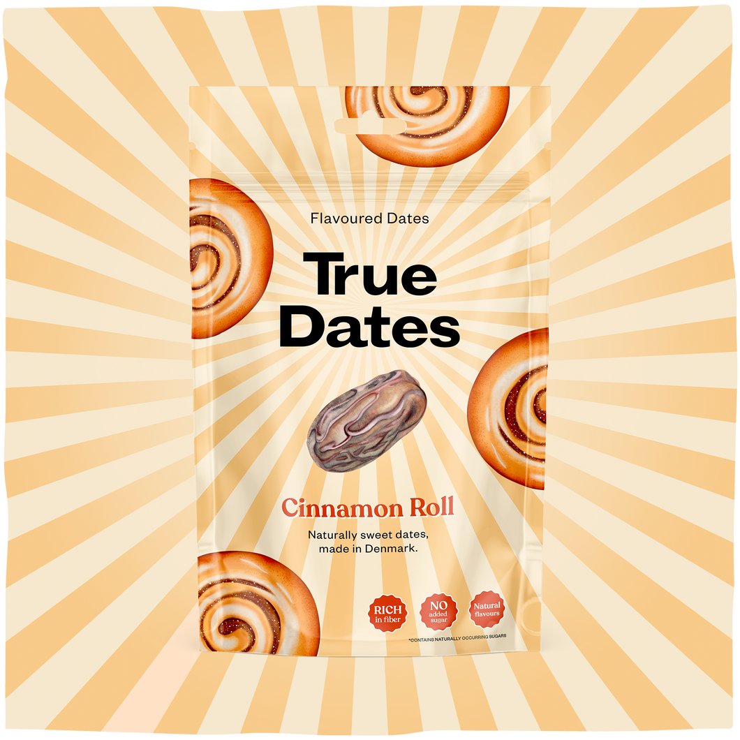 A packet of True Dates cinnamon-roll flavoured dates sits against a cream-and-orange sunburst, decorated with spiral pastries and one date. Warm, playful packaging.