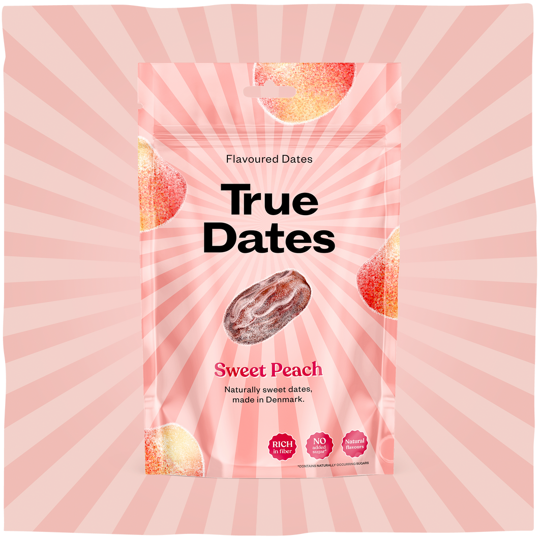 A pink True Dates Sweet Peach flavoured dates pouch with a central date and peach illustrations, set against a pink sunburst backdrop.